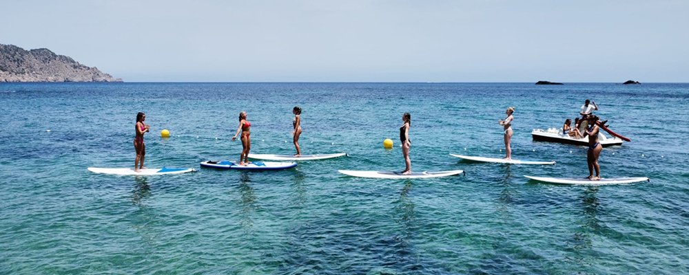 sup yoga pilates class in the sea